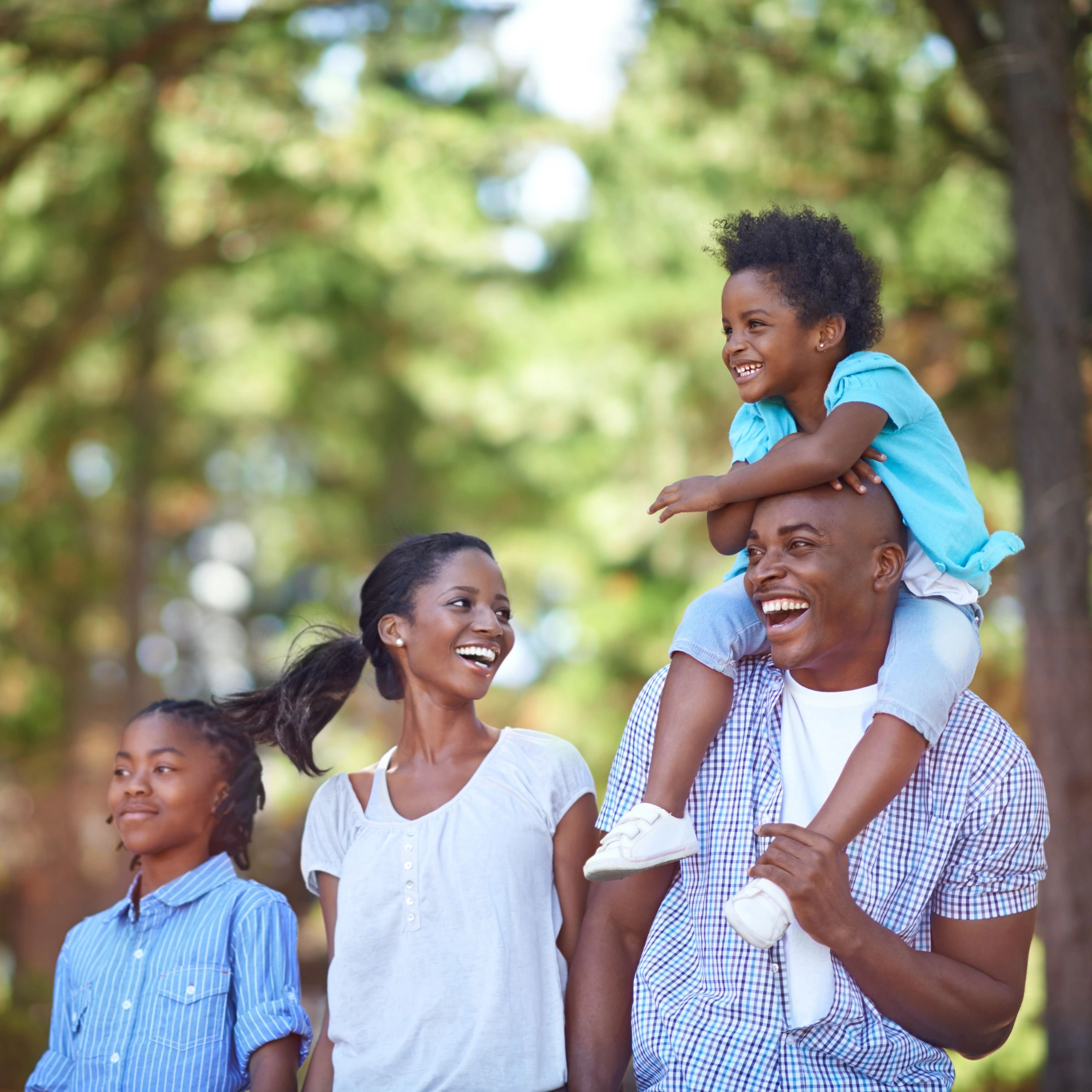 African American family spending time outdoors together