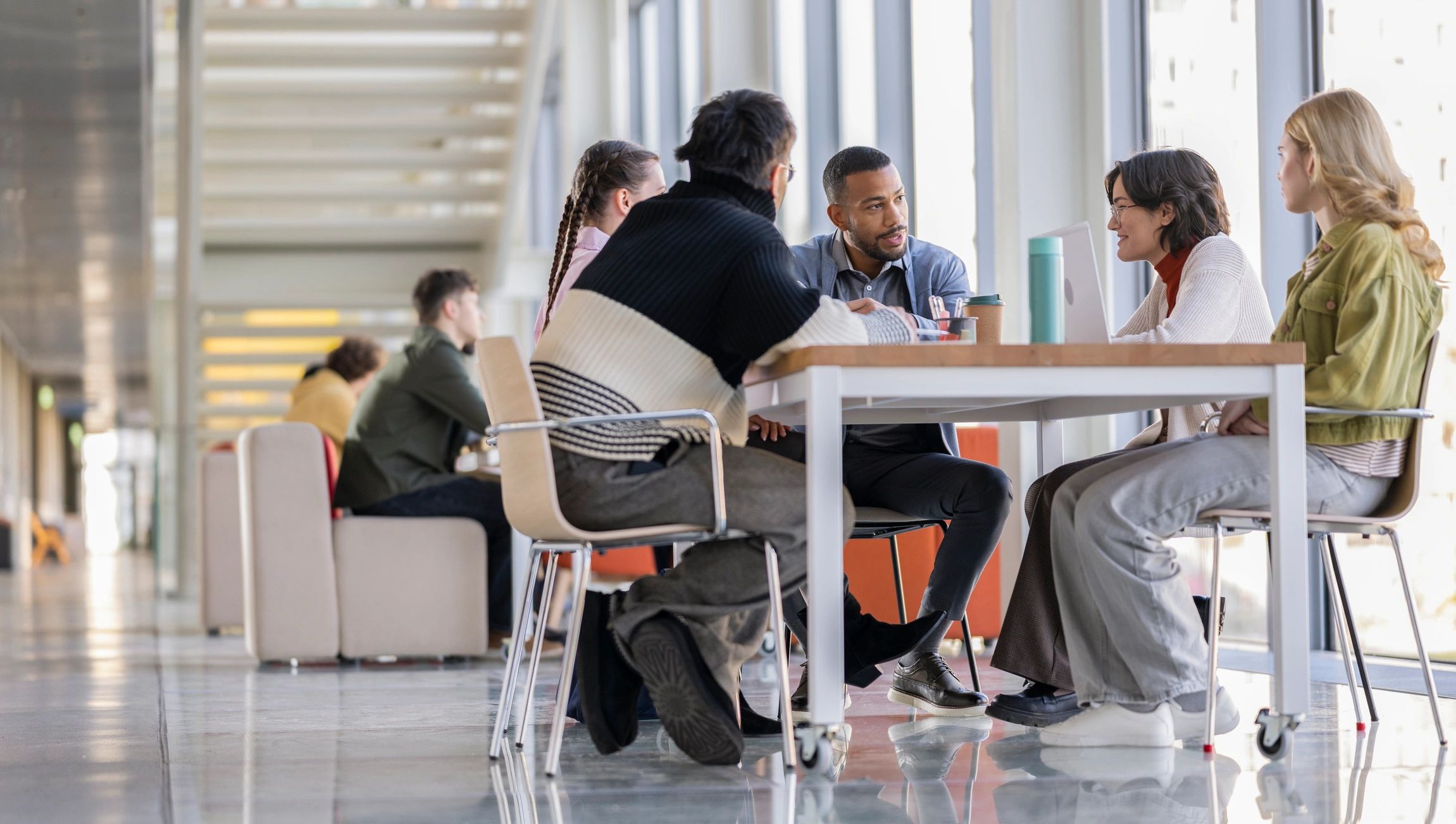 Diverse Colleagues Brainstorming in Modern Office